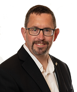 Headshot of James Devine on white background