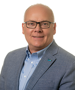 Headshot of John Rademacher on white background