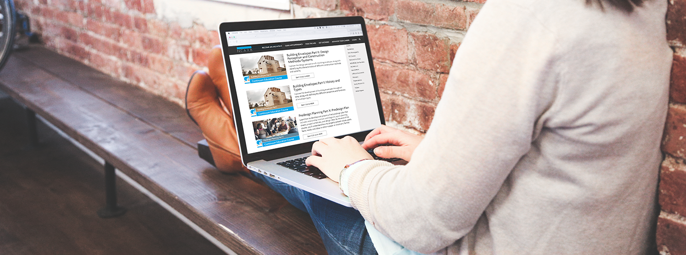 woman looks at continuing education courses on laptop