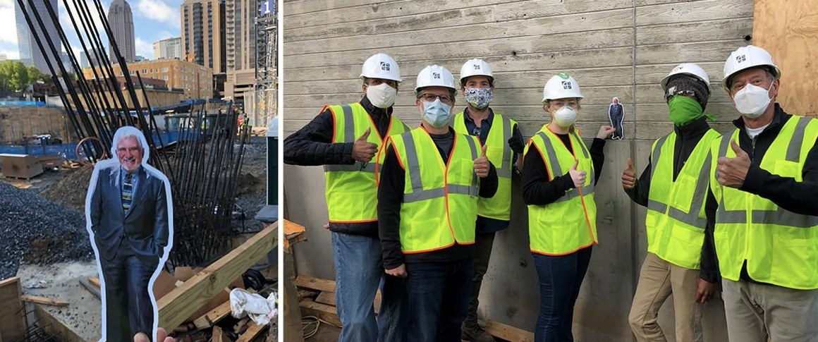 Photo of a group of construction workers holding a cutout of "Flat Jerry."