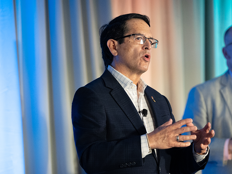 NCARB President Alfred Vidaurri presenting on a stage at a conference