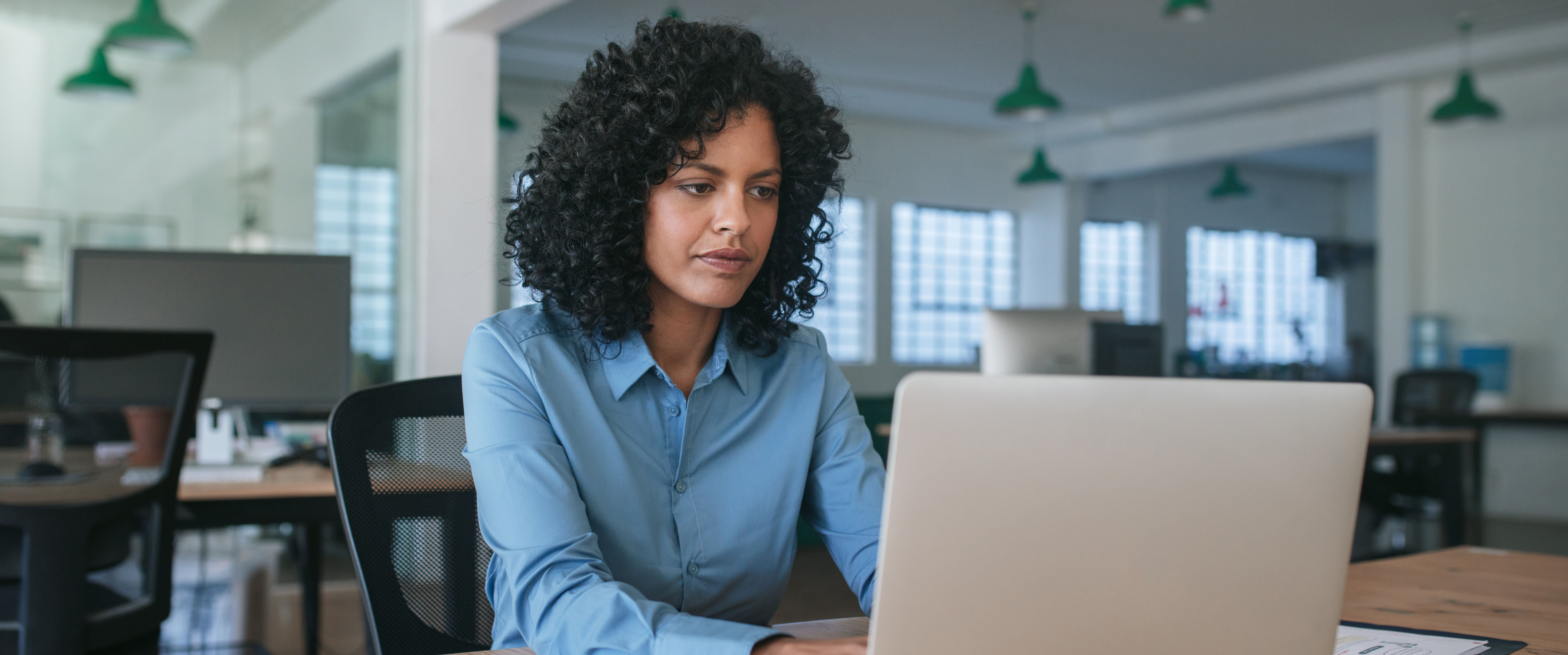 A woman working on a computer. 