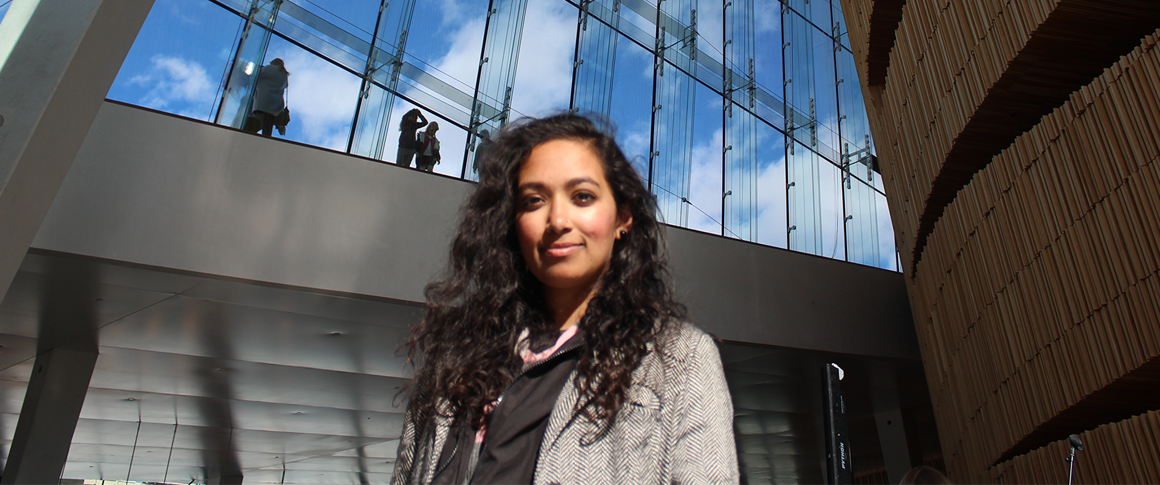 Architect Farah Ahmad in front of building