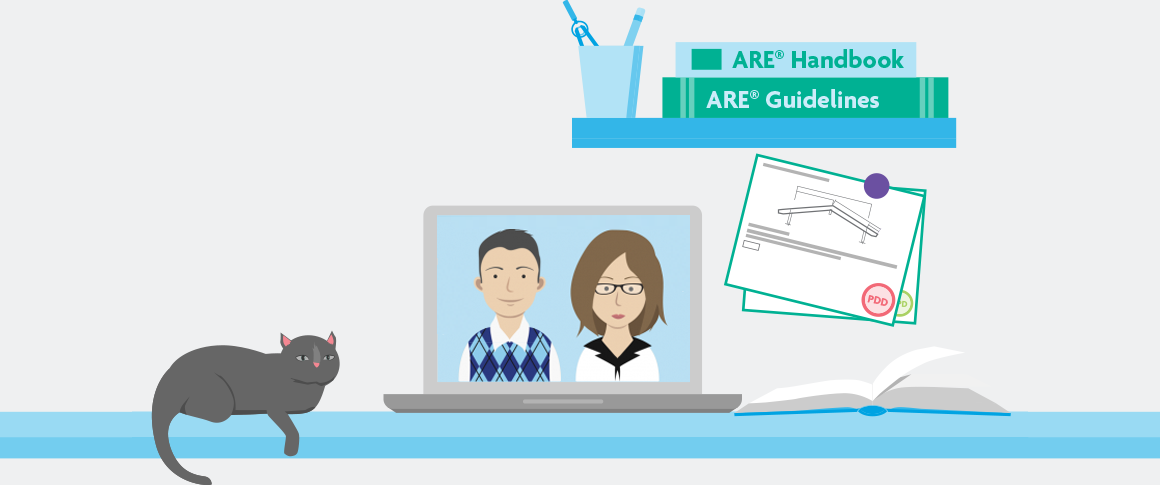 A laptop sits open on a desk, with an image of NCARB staff answering questions on screen. A cat sits on the desk alongside several ARE study materials. 