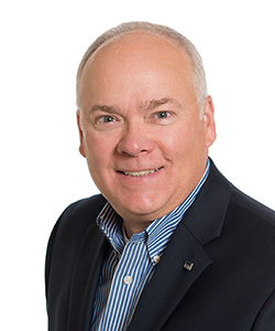 Headshot of John Rademacher on white background