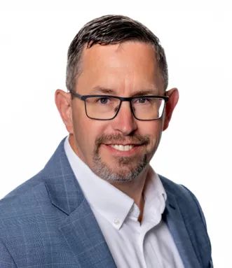 Headshot of James Devine.