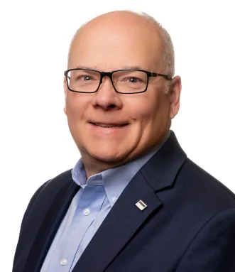 Headshot of John Rademacher in 2025. 