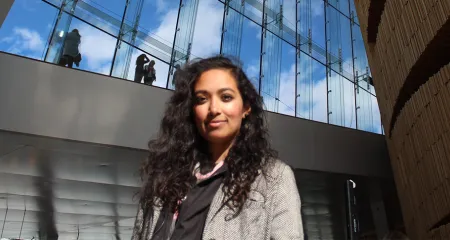 Architect Farah Ahmad in front of building