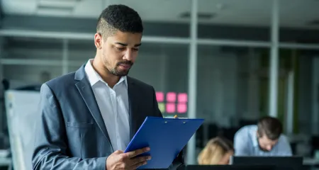 A man looking at his work. 