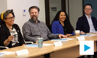 Members of committee laugh during discussion