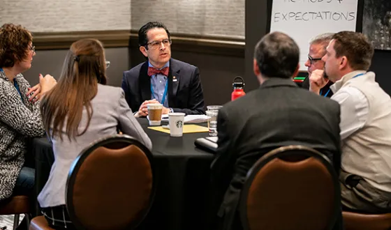 Six volunteer committee members, including past NCARB president Alfred Vidaurri, sit at a round table discussion during the 2019 Committee Summit.