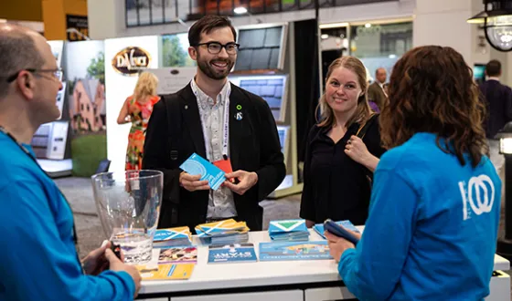 Two NCARB employees fulfill the organization’s mission by answering customer questions at the annual AIA National Conference.