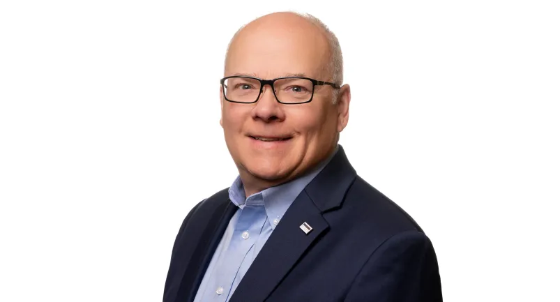 Headshot of John Rademacher in 2025. 