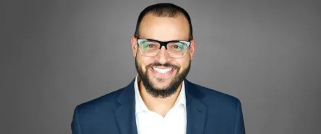 Richie Hands smiling and wearing a suit.