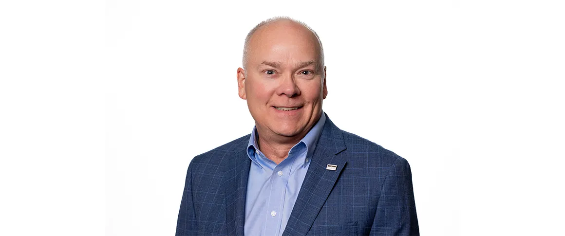 Headshot of John Rademacher.