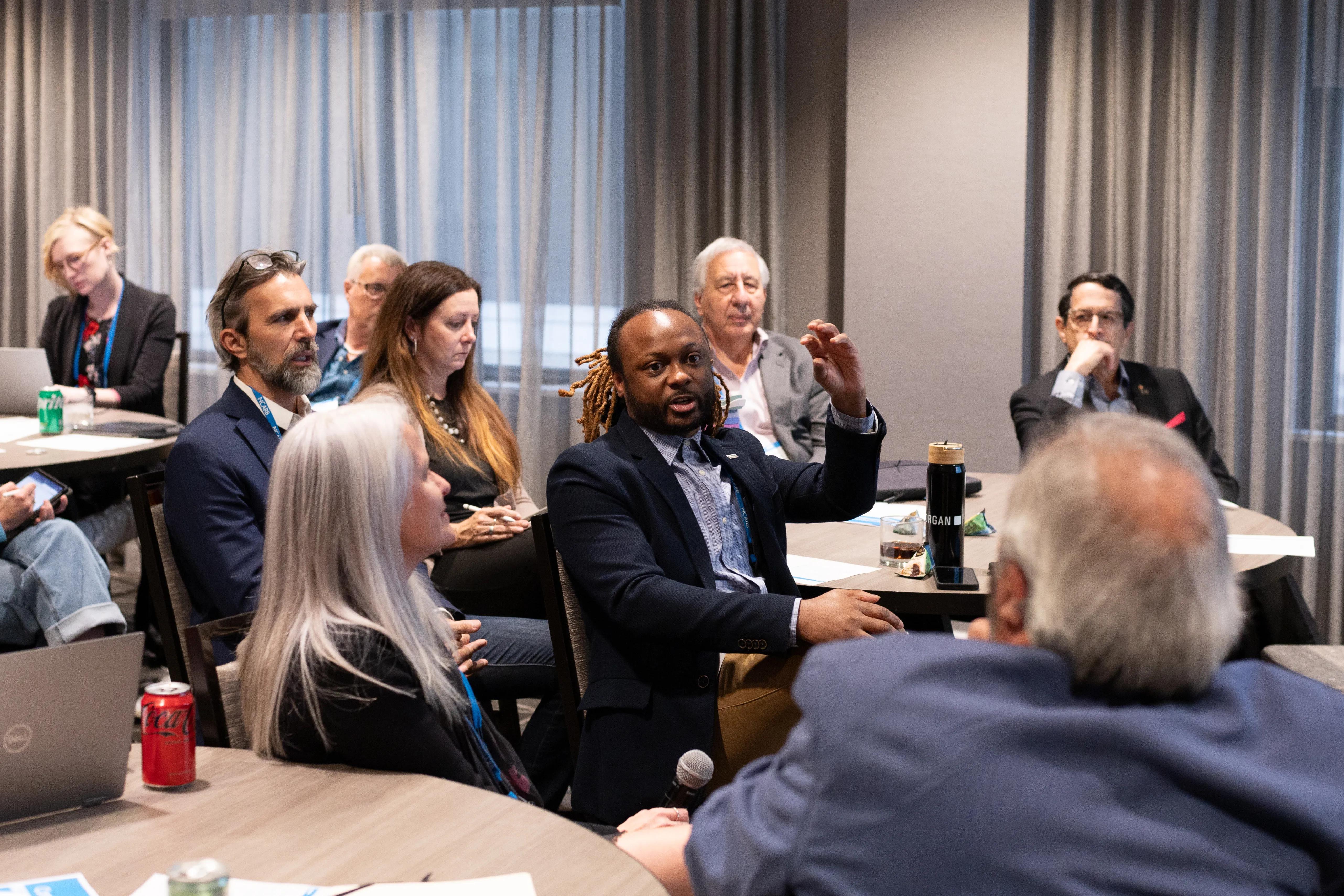 Committee members engaged in discussions during the 2024 Committee Summit in Washington, DC.