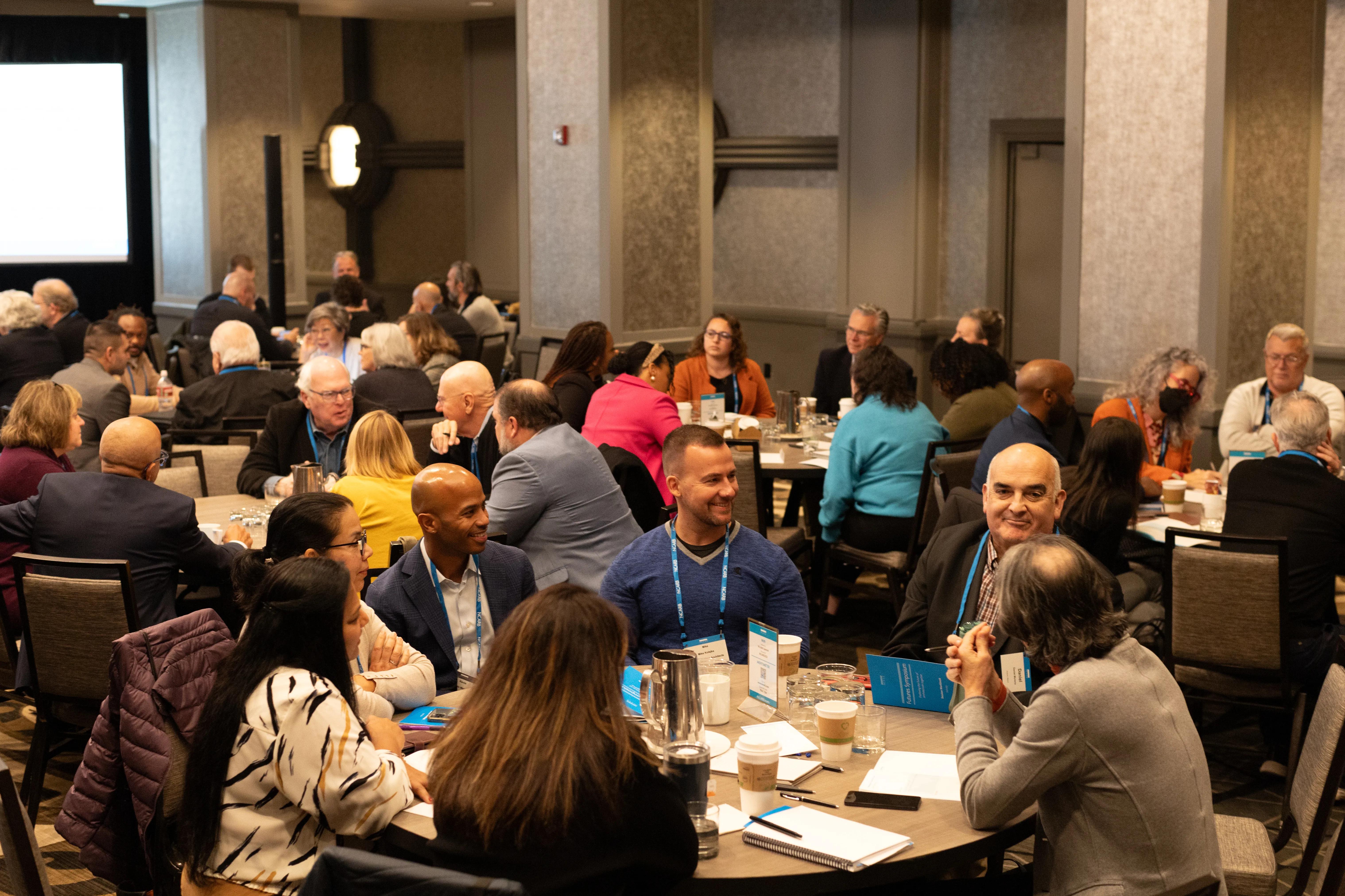 Volunteers engage in small group discussions.