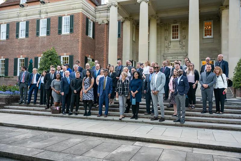 Attendees of the U.S.-U.K. MRA event gather for a photo at the celebratory reception.