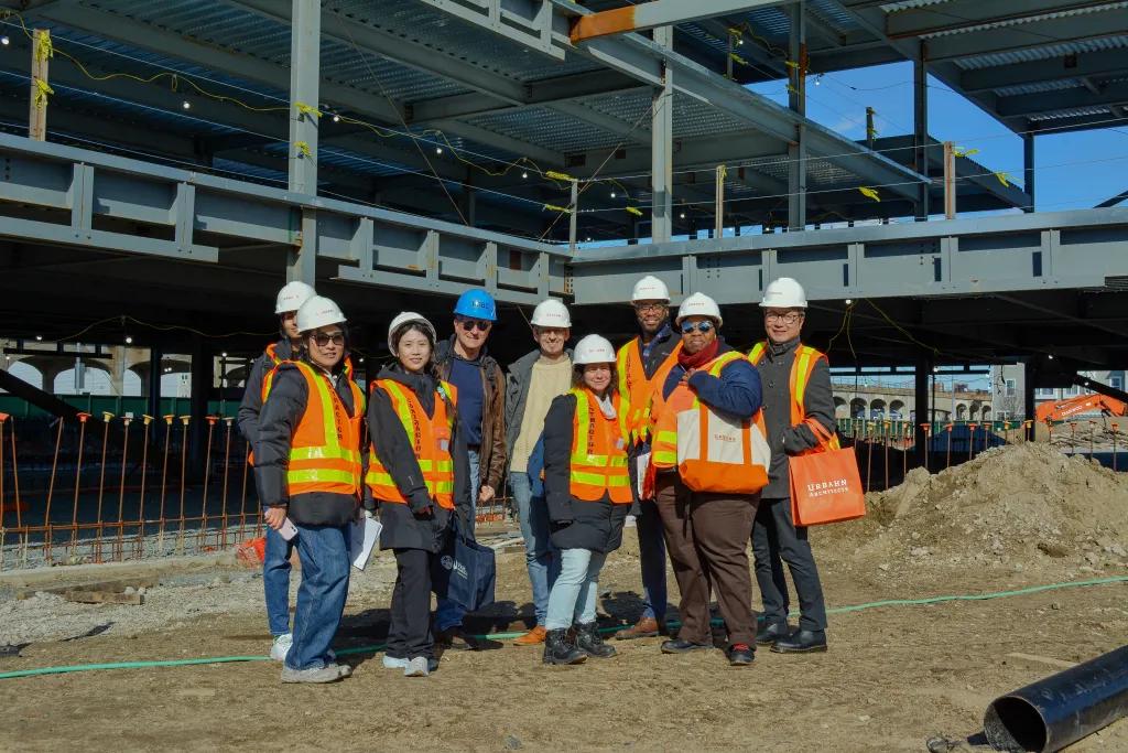 A group of emerging professionals at a construction site.
