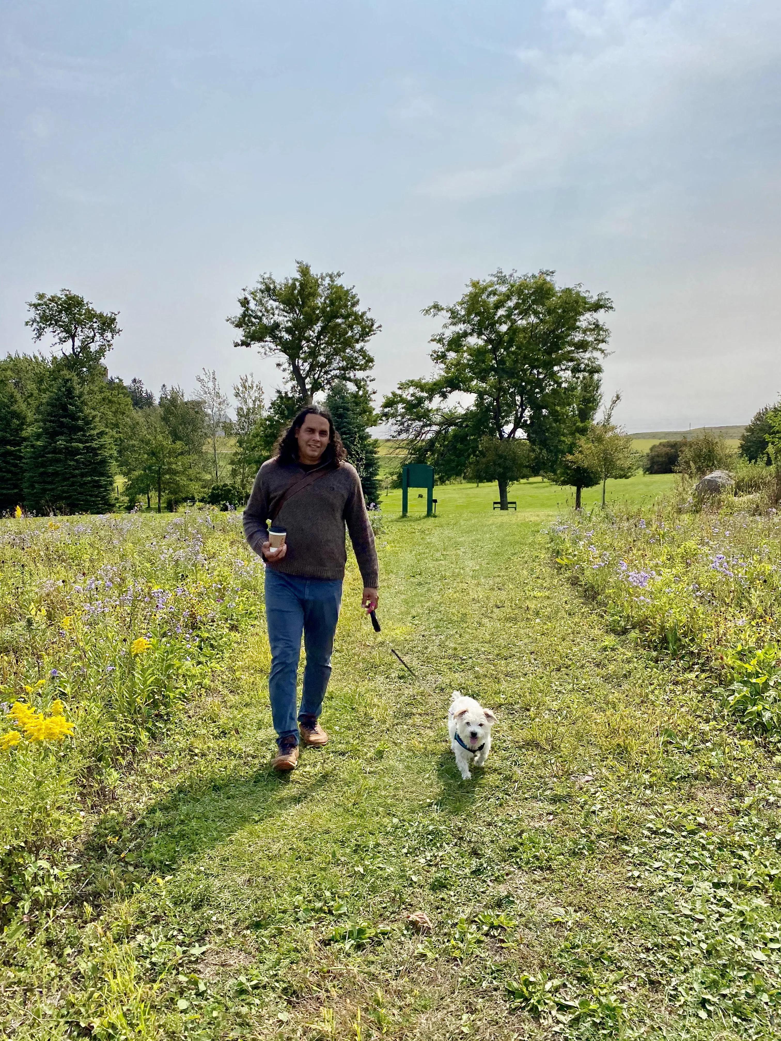 Jaime Ycaza and his dog taking a walk.